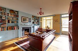 townhouse living room with blue and yellow walls