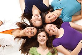 teenage girls sitting in a circle